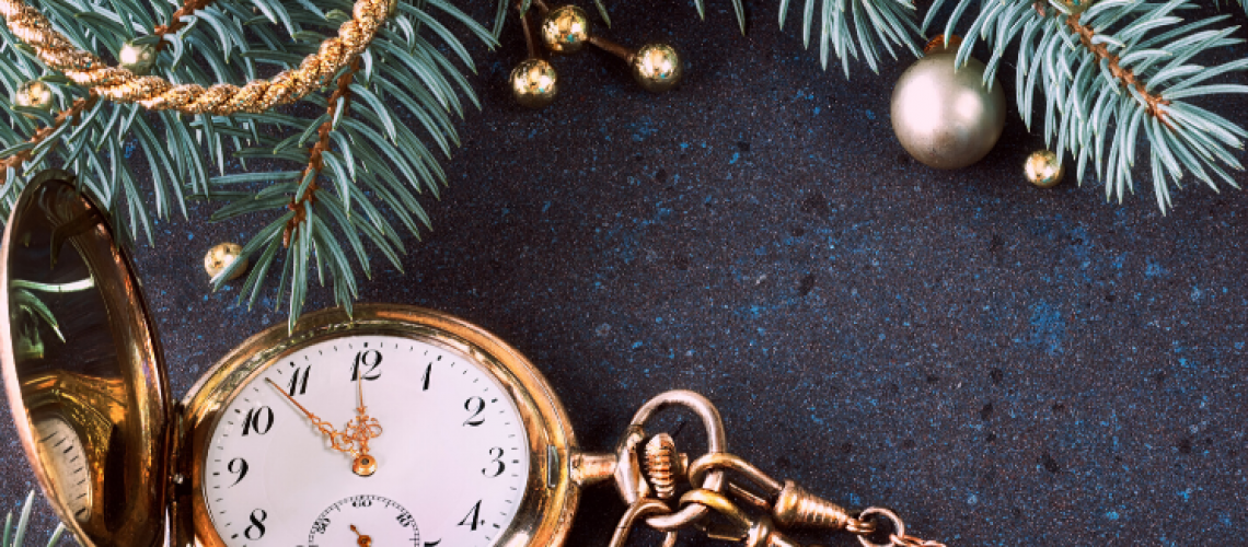 pocket watch around christmas tree year end planning
